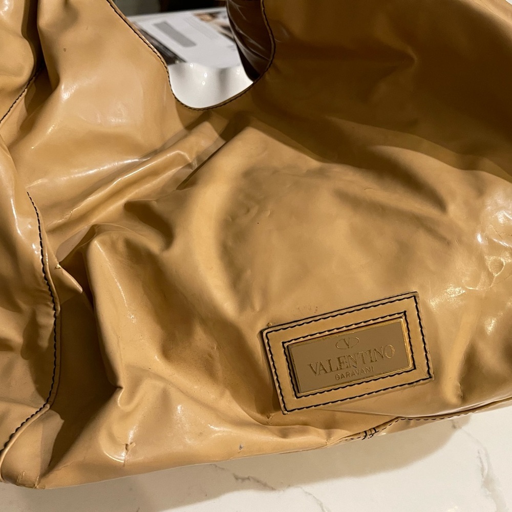 VALENTINO ICONIC HOBO BAG WITHSide BOW W/DUSTCLOTH
designer’s most iconic design